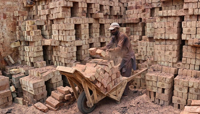 Brickmakers in Punjab's Sheikhupura scorched by sun above and fire below